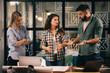 © JustLife - Successful teamwork. Business people in office.
