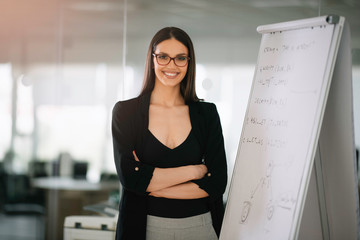 Wall Mural - Female manager at the office. Beautiful woman preparing for the meeting.