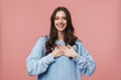 © Drobot Dean - Image of happy caucasian woman smiling and holding hands on her chest