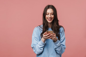 image of happy beautiful woman smiling and using smartphone