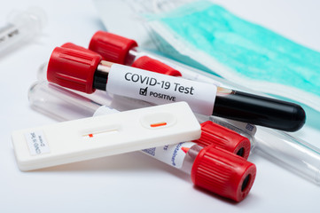 the covid-19 test kit and test tube with contaminated blood sample inside.for check the patient and bring to treat the disease on hospital.