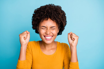 Poster - Close up photo funky excited afro american girl wait her ideal perfect birthday present gift surprise raise fists close eyes wear stylish trendy sweater isolated blue color background