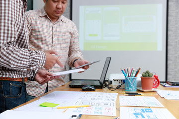 Wall Mural - graphic designers work together with ux ui designer planning application template layout framework f