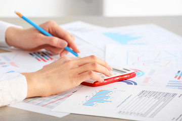 Wall Mural - Female accountant working in office, closeup