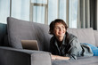 © Drobot Dean - Image of caucasian young joyful woman using laptop and smiling