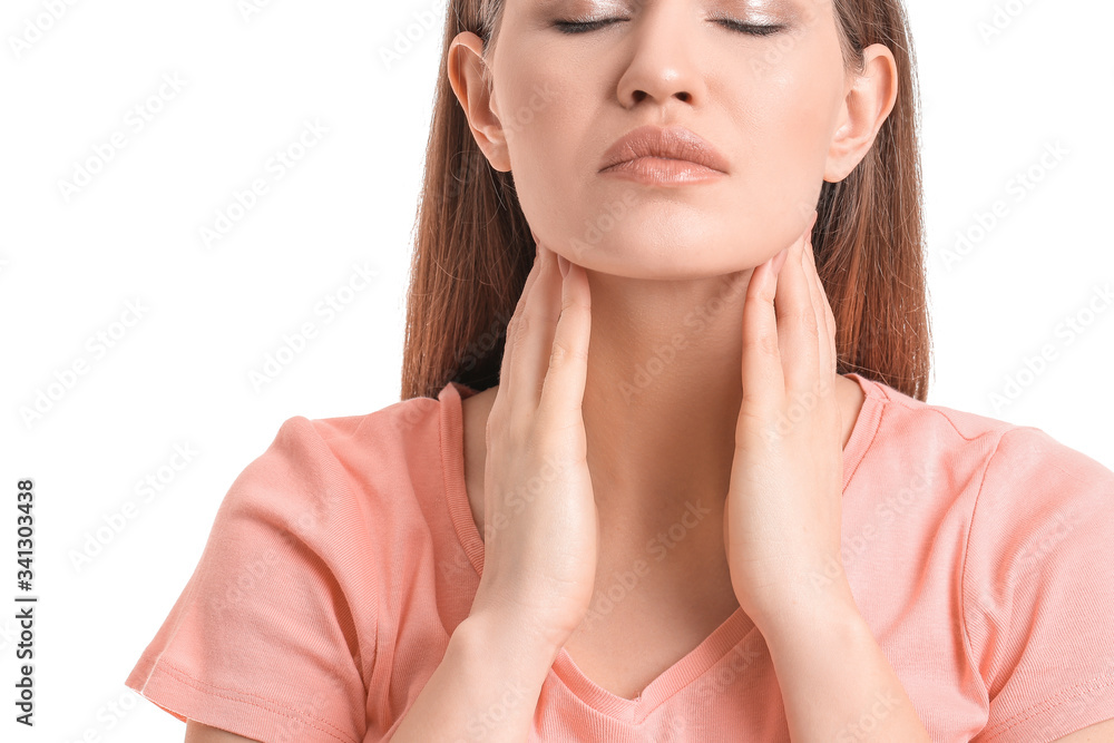 Young woman with thyroid gland problem on white background