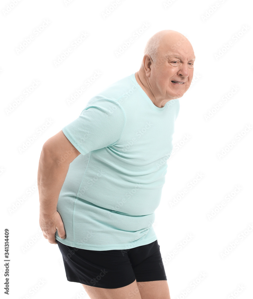 Elderly man suffering from hemorrhoids on white background