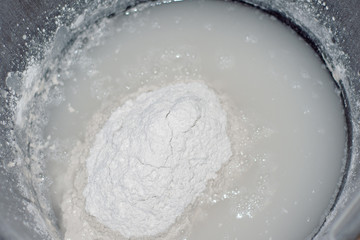 Repair powder soaks in a construction bucket