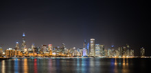 Illuminated City At Waterfront