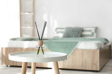 Poster - Reed diffuser on table in bedroom