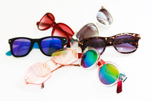 Sunglasses With Colored Lenses And Plastic Frames