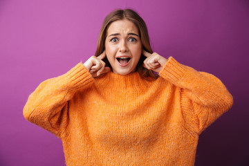 Sticker - Image of surprised young woman smiling and plugging her ears