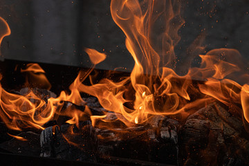 Background of burning hot coals. Burning coals in the brazier. Kindling the fire for the barbecue.