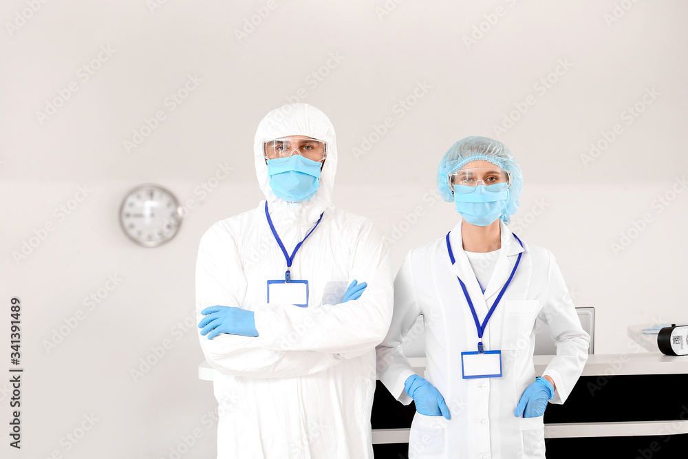 Receptionist with doctor in hall of clinic