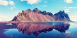 Exciting beautiful landscape with most breathtaking mountains Vestrahorn on the Stokksnes peninsula in the mirror of the lake. Exotic countries. Amazing places. (Meditation, antistress - concept).