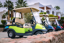 Electric Cars For Moving Around The Resort Complex Of A Five-star Hotel. A Means Of Transportation For Tourists. Several Golf Cars Are Parked In The Parking Lot.