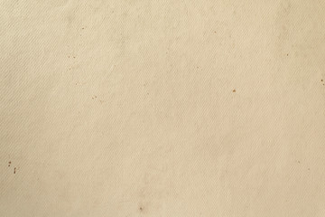 Sloppy texture of old beige cardboard paper. Light vintage background.