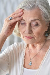 Canvas Print - Portrait of sad ill senior woman with headache