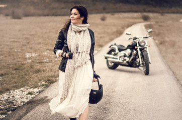 Young woman on a motorcycle on the roud 