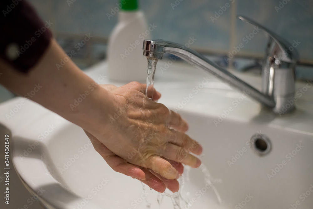 Adult woman washing hands with antibacterial soap. Hygiene concept ...