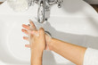 © sonyachny - Rubbing fingers top view, Washing hands with antibacterial soap in proper technique on background of flowing water in white bathroom. Prevention coronavirus. Cleaning and disinfecting