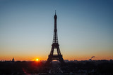 Fototapeta Boho - Eiffel tower silhouette against the backdrop of the rising sun. Beautiful sunrise over Paris