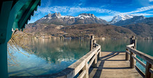 Pier In Annecy With Mountains In The Background In The French Alps
