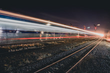Light Trails On Railroad Track At Night