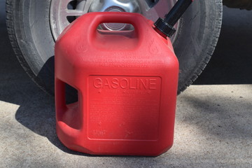 Sticker - Gas Can by a Car Tire