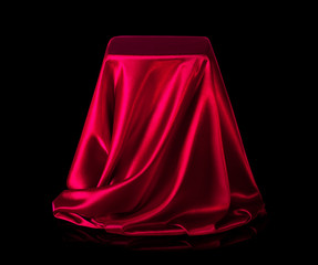 Presentation pedestal covered with red silk cloth.