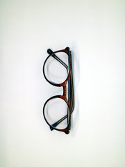 Brown glasses on white background.