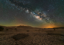 Scenic View Of Desert Against Sky At Night