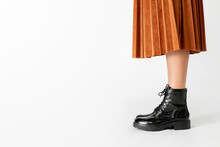Woman In A Skirt Wearing Combat Boots