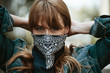 © rawpixel.com - Woman covering her mouth with a bandana during coronavirus outbreak