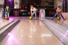 Little Children Playing Bowling In Club