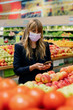© rawpixel.com - Woman in a face mask while shopping in a supermarket during coronavirus quarantine