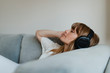 © rawpixel.com - Woman listening to music  during coronavirus quarantine on a couch