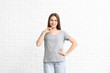 © Pixel-Shot - Young woman in stylish t-shirt on white background