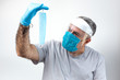 © Eduardo Lopez - COVID-19. Adult man with double mask and latex gloves