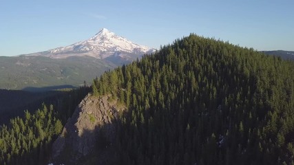 Wall Mural - Aerial view, forest and volcano during beautiful sunny day. Mount Hood is active stratovolcano in the Cascade Volcanic Arc. Pacific Northwest region of the United States. Oregon, USA Background nature