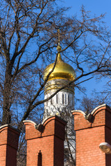 Wall Mural - Ivan the Great bell tower behind the Kremlin wall.