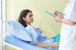 © eakgrungenerd - Doctor and patient woman discussing something health care in room of hospital, health care concept.
