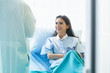 © eakgrungenerd - Happy patient woman discussing something health care in room of hospital, health care concept.