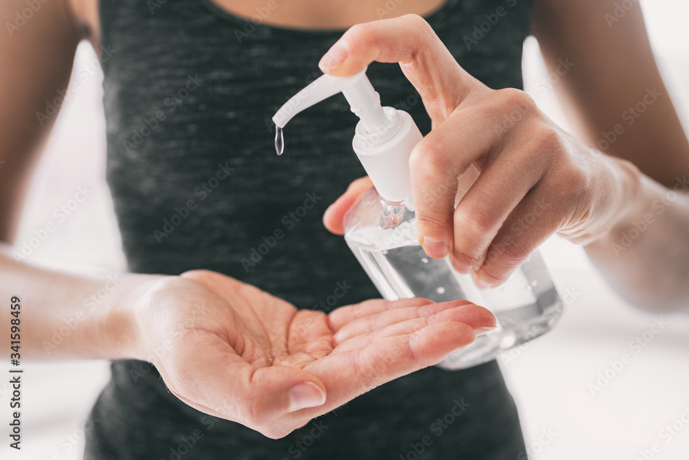 Hand sanitizer hygiene bottle disinfecting hands rubbing with gel for COVID-19 outbreak spreading prevention. Coronavirus protection. - obrazy, fototapety, plakaty 