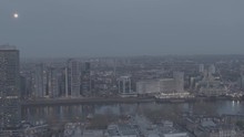 Central London And River Thames Aerial Drone Shot. Forwards Flying At Dusk. Needs Colour Grading. Busy Metropolis City In The Evening, Night Time. Mi5, Mi6 Building 