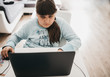 © tselykh - Caucasian girl working with laptop, online education at home, lockdown during coronavirus