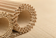 Carton Or Cardboard Packing Material. Texture Of Corrugated Paper Sheets Made From Cellulose. Supplies For Creating Boxes And Packaging. Pasteboard Background. Natural Brown Cardboard Surface.
