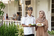 © Odua Images - beautiful woman with friend carry food for breaking the fast