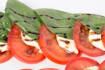 Wall Mural - Fragment of salad with tomato and mozzarella.