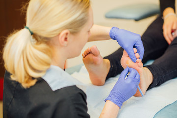 Podiatrist working on Feet